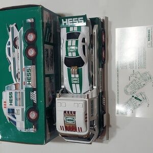 Hess 2016 toy truck and dragster  gently displayed. Box has  some wear.
